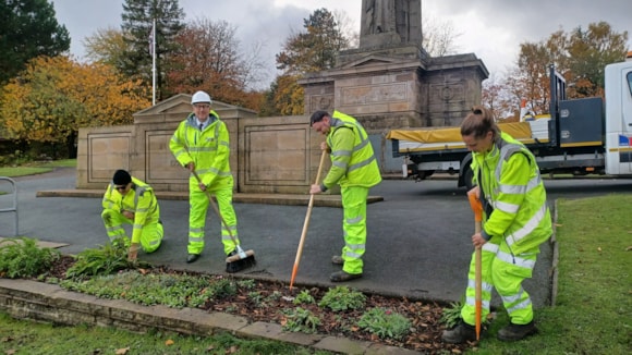 Cllr Warren Goldsworthy and LCC staff at Accrington War Memorial in Oak Hill Park cropped