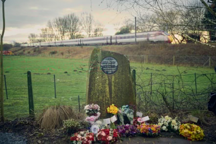 An LNER train passes the Great Heck memorial garden, LNER