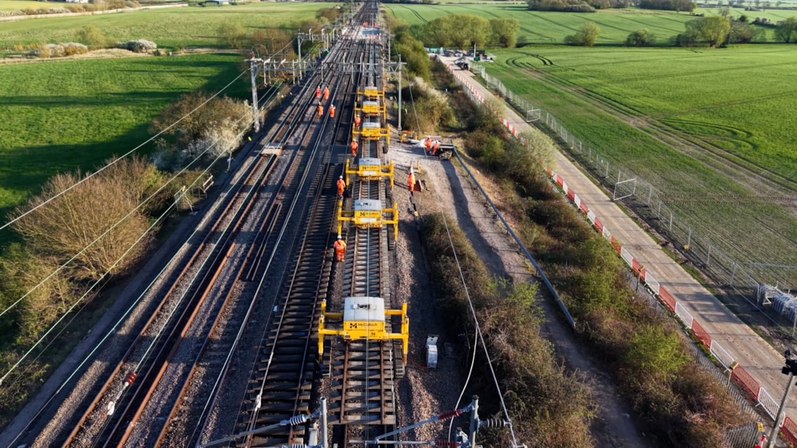 PHOTO Track panels being carried on lifters to be installed on new bridge deck in Ledburn Easter 2026
