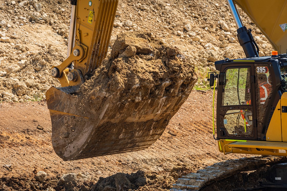 Excavator at work on the Barton Mixbury cutting Spring 2023