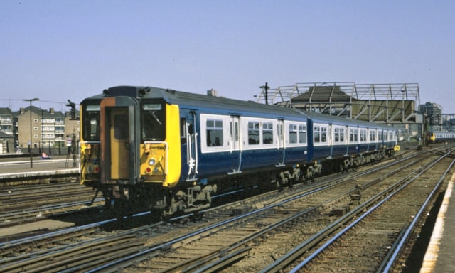 Class 455 in British Rail blue livery - credit: Jeremy Chapter: A Class 455 at Clapham Junction in 1984, in its original livery of British Rail blue and Minerva grey. Credit: Jeremy Chapter.