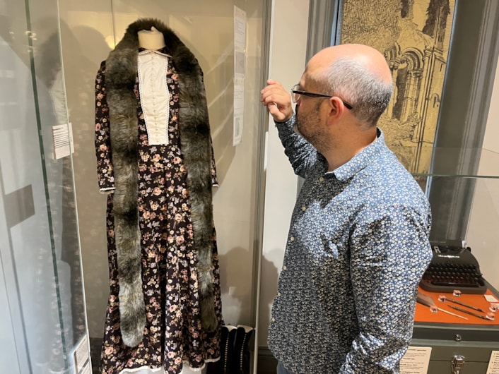 Literature in Leeds: Curator Patrick Bourne with a dress created as part of theatre show and exhibition Corseted, which centred around the life and work of radical Leeds suffragist Alice Cliff Scatcherd.
The dress is based on one worn by Alice when she opened the Morley Friends Adult School in 1894 and sits alongside objects chosen by writer and performer, Becky Cherriman, whose own work touches on themes such as women’s history and industrial working conditions.