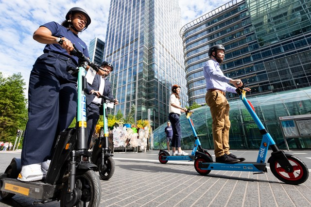 Group of people riding the e-scooters