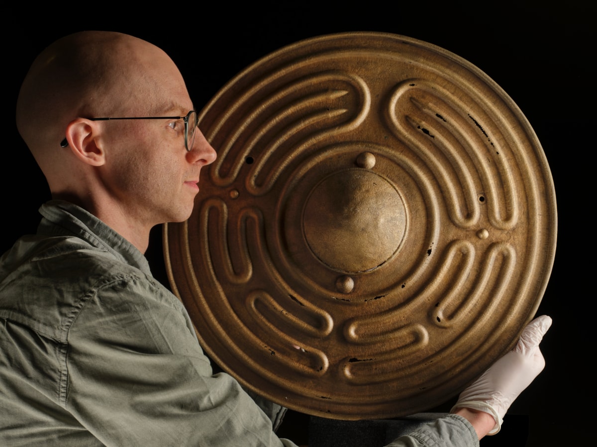 National Museums Scotland curator Dr Matthew Knight with the Bronze Age shields. Photo © Duncan McGlynn (1)