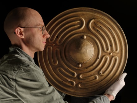National Museums Scotland curator Dr Matthew Knight with the Bronze Age shields. Photo © Duncan McGlynn (1)