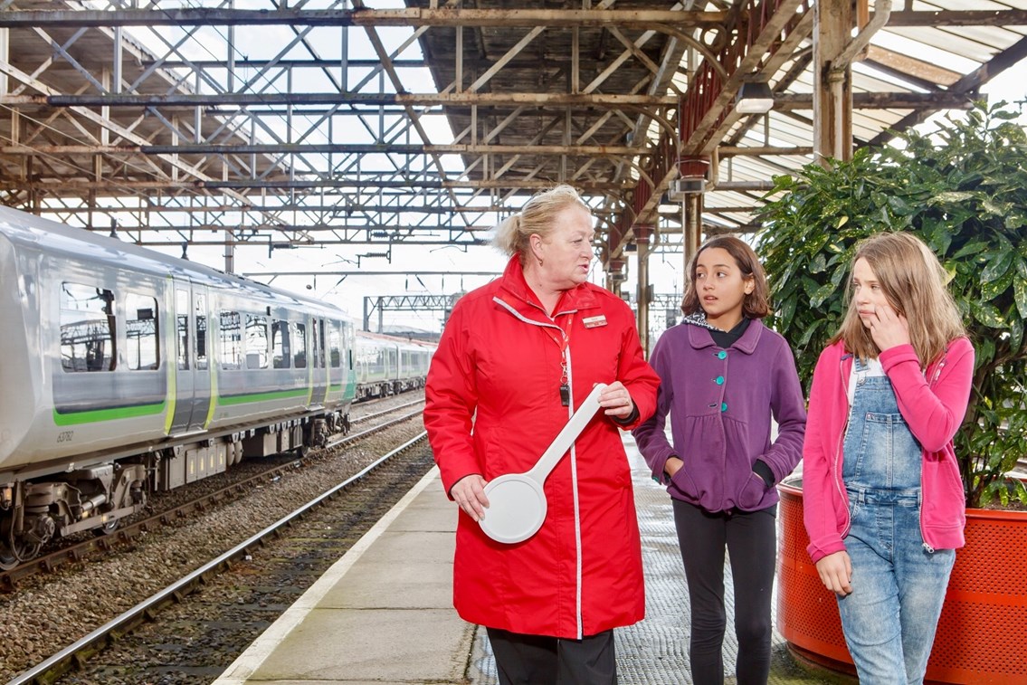 Railway Children Sleepout: Station staff leading children (models) to help
