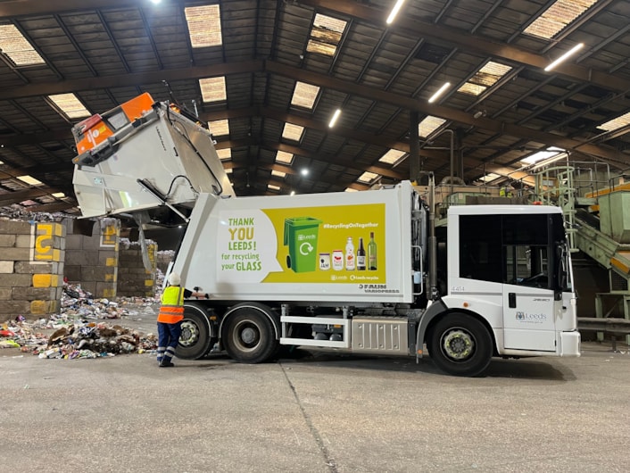 Glass recycling bin wagon: Glass recycling bin wagon at waste processing warehouse in Leeds