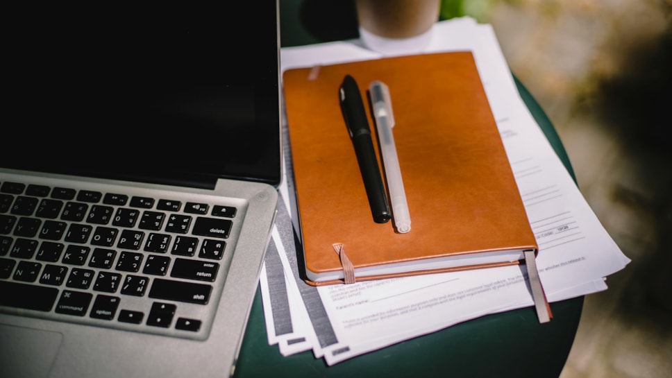 Pens and paper on a desk