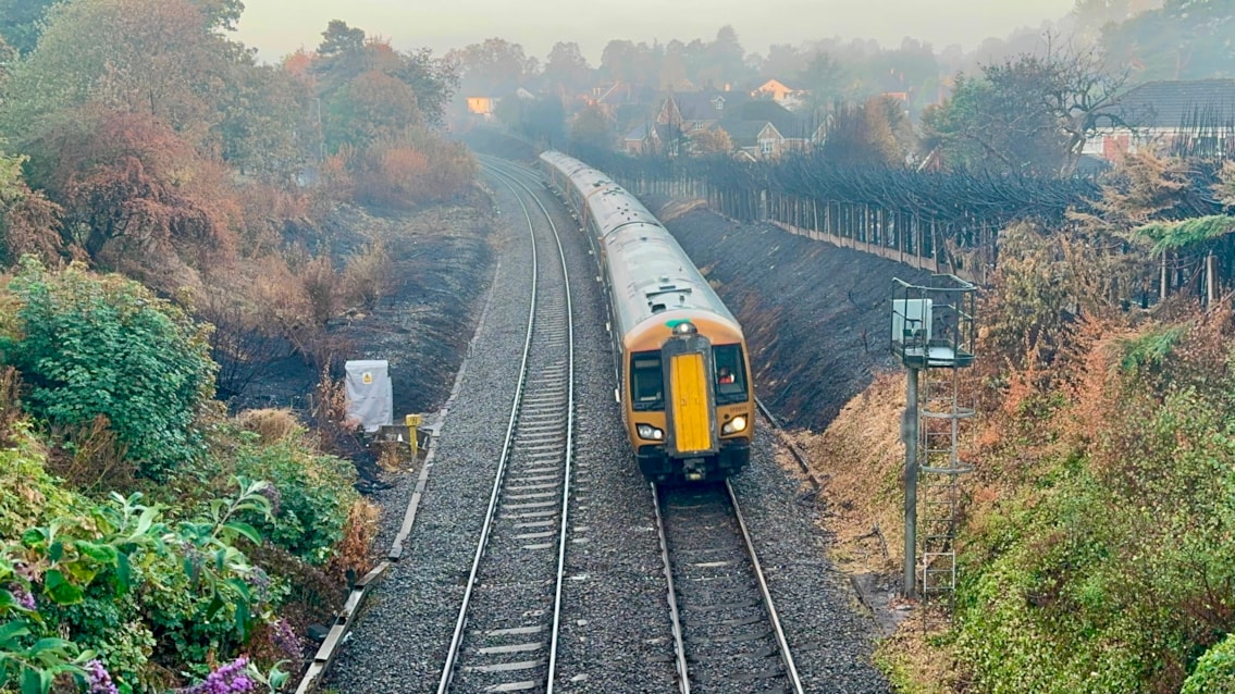 Trains return to Stourbridge after major wildfire recovery effort: First West Midlands Railway train travelling through repaired section of railway in Stourbridge