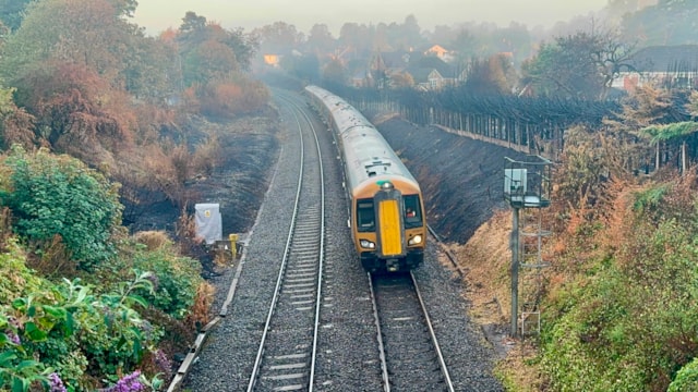 Trains return to Stourbridge after major wildfire recovery effort: First West Midlands Railway train travelling through repaired section of railway in Stourbridge