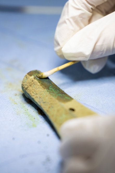 Conservator Bethan Bryan works on the Peebles Hoard. Photo © Duncan McGlynn (2)