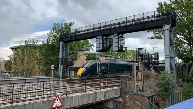 Rail passengers advised to check before using rail services to Oxford at weekends from 10 September to 2 October: A GWR train leaving Oxford station over the existing Botley Road bridge