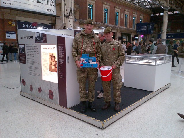 Soldiers at WWI exhibition stand at London Victoria: 2015 Poppy Day