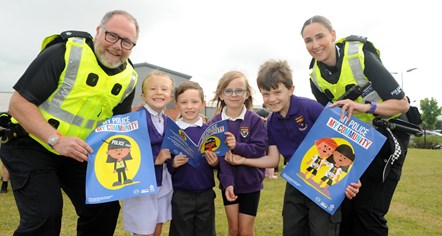 Superintendent Derek Frew with campus officer PC McPike and P3 from Annanhill PS