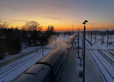Ukrainian Railways sleeper train at sunset in Chelm