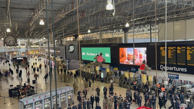 Armed Forces personnel abseiling at London Waterloo station 301025
