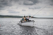 Llyn Brenig Fishing boat and Anglers on lake