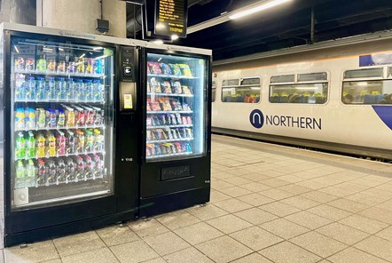 Image shows vending machine on platform with Northern service in background