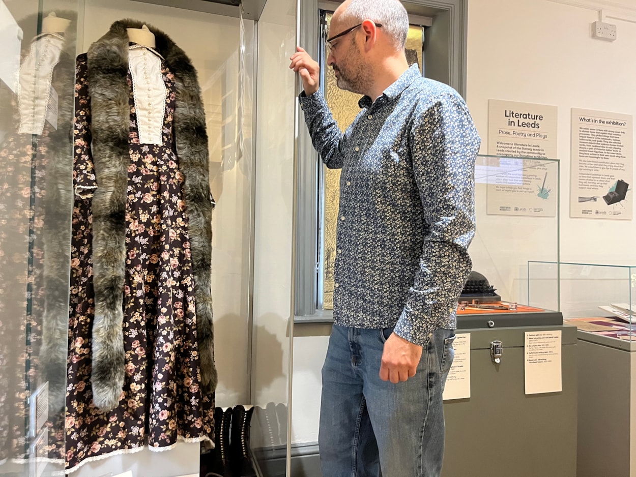 Literature in Leeds: Curator Patrick Bourne with a dress created as part of theatre show and exhibition Corseted, which centred around the life and work of radical Leeds suffragist Alice Cliff Scatcherd.
The dress is based on one worn by Alice when she opened the Morley Friends Adult School in 1894 and sits alongside objects chosen by writer and performer, Becky Cherriman, whose own work touches on themes such as women’s history and industrial working conditions.