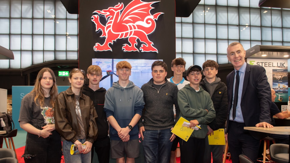 Adam Price, Cabinet Minister for Enterprise, Connectivity and Energy, with pupils from Ysgol Maes Garmon