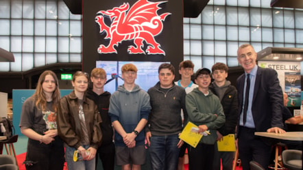 Adam Price, Cabinet Minister for Enterprise, Connectivity and Energy, with pupils from Ysgol Maes Garmon