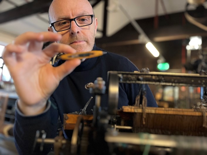 Miniature loom: John McGoldrick, Leeds Museums and Galleries' curator of industrial history, conserves the miniature scale model of the looms manufactured by Barnsley’s Wilson and Longbottom.