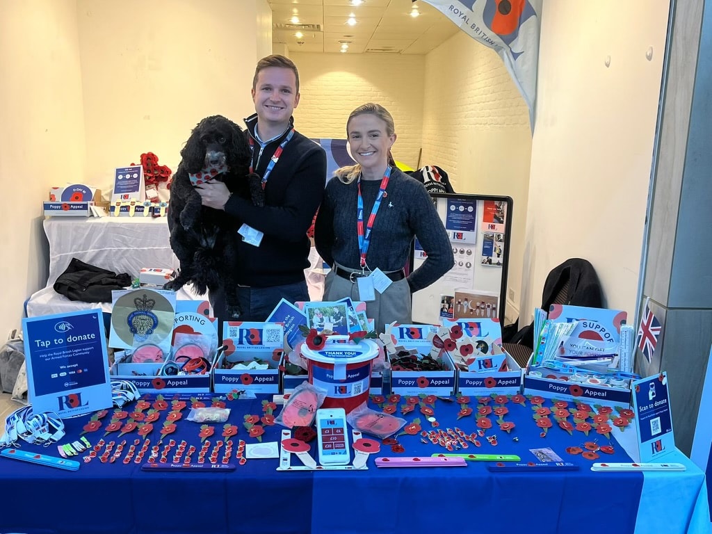 Garry and Charlotte volunteering at a Royal British Legion fundraiser (with their cockapoo Bonnie) – Network Rail