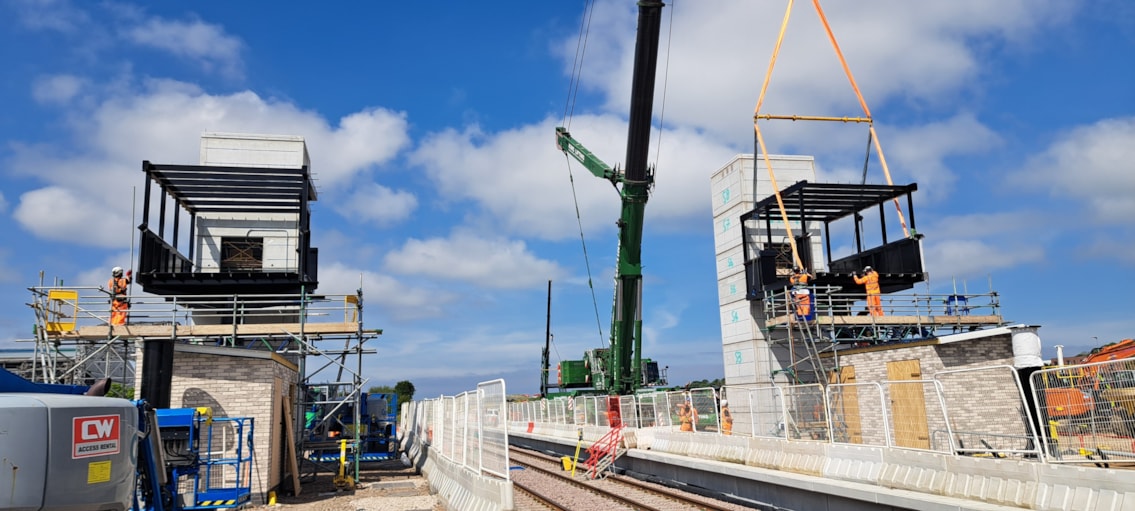 Teams installing the footbridge at Bristol Brabazon station