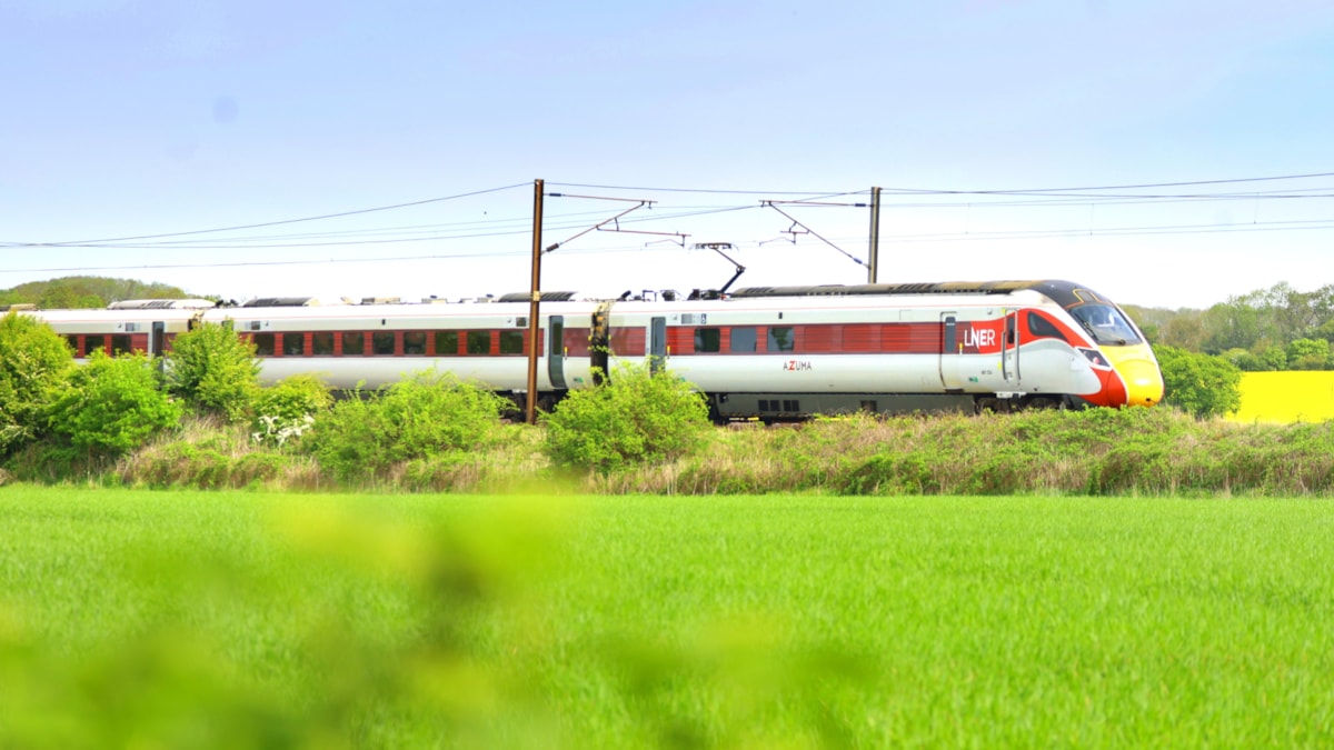 An LNER Azuma passes along the East Coast Main Line, LNER cropped
