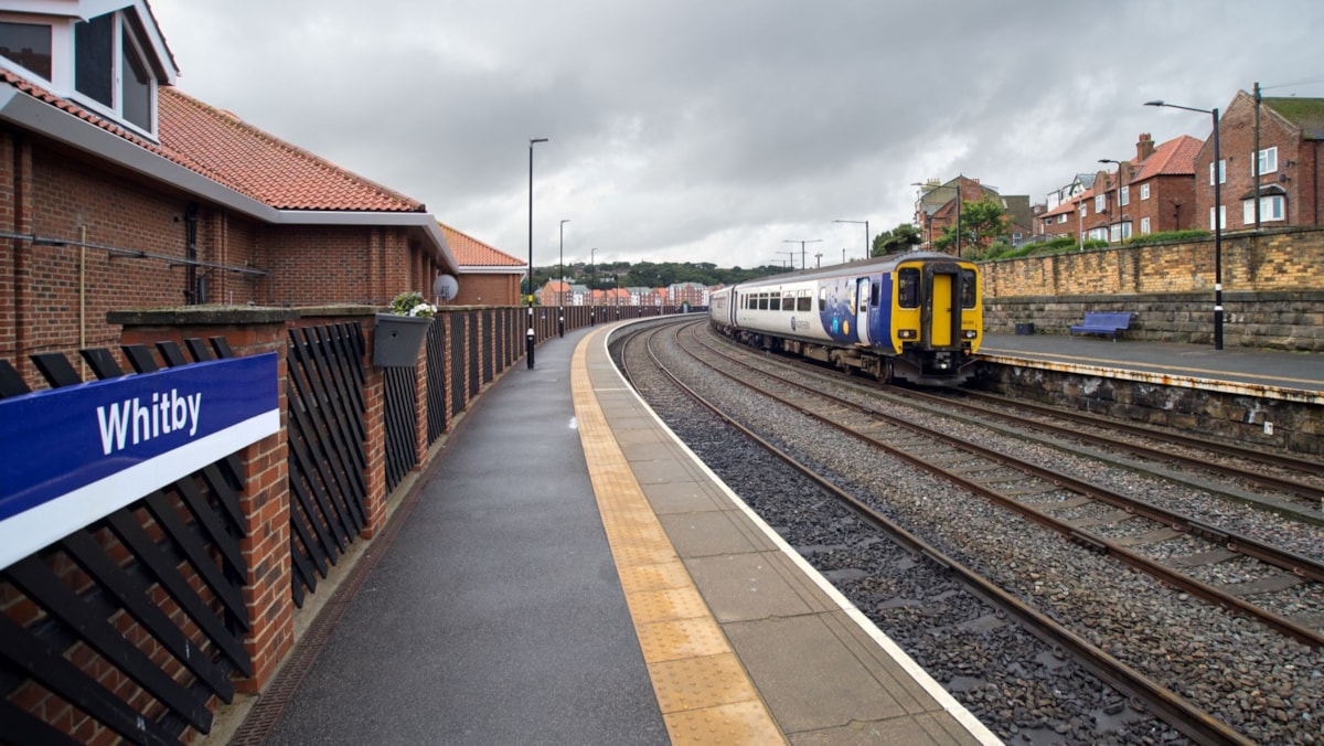 Image shows a Northern train at Whitby Station cropped