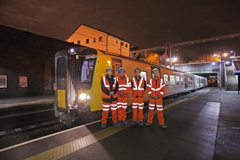 NW electrification:  the project team with the first train at Eccles
