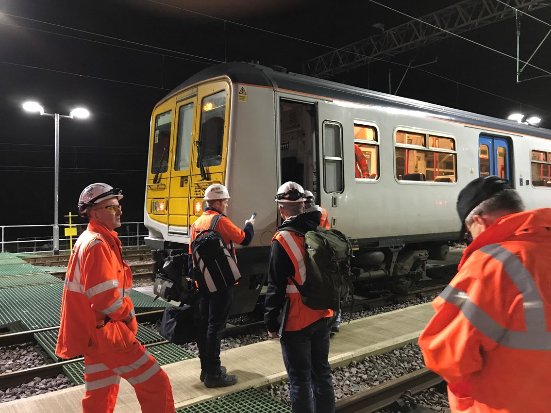 Final 100mph speed checks on newly electrified Manchester to Preston railway: Engineers about to board the final electric test train between Preston and Manchester Victoria