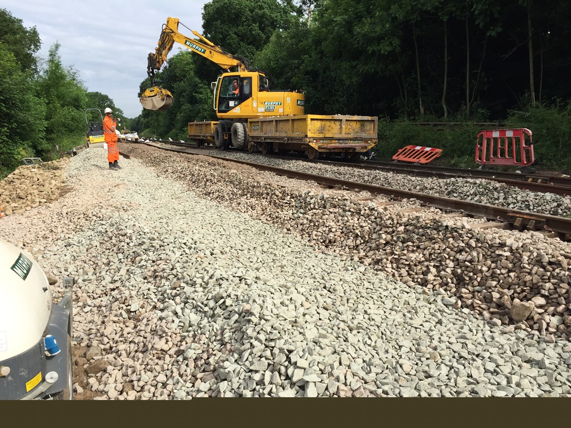 A Road Rail Vehicle working on the site of the landslip at Middlewood