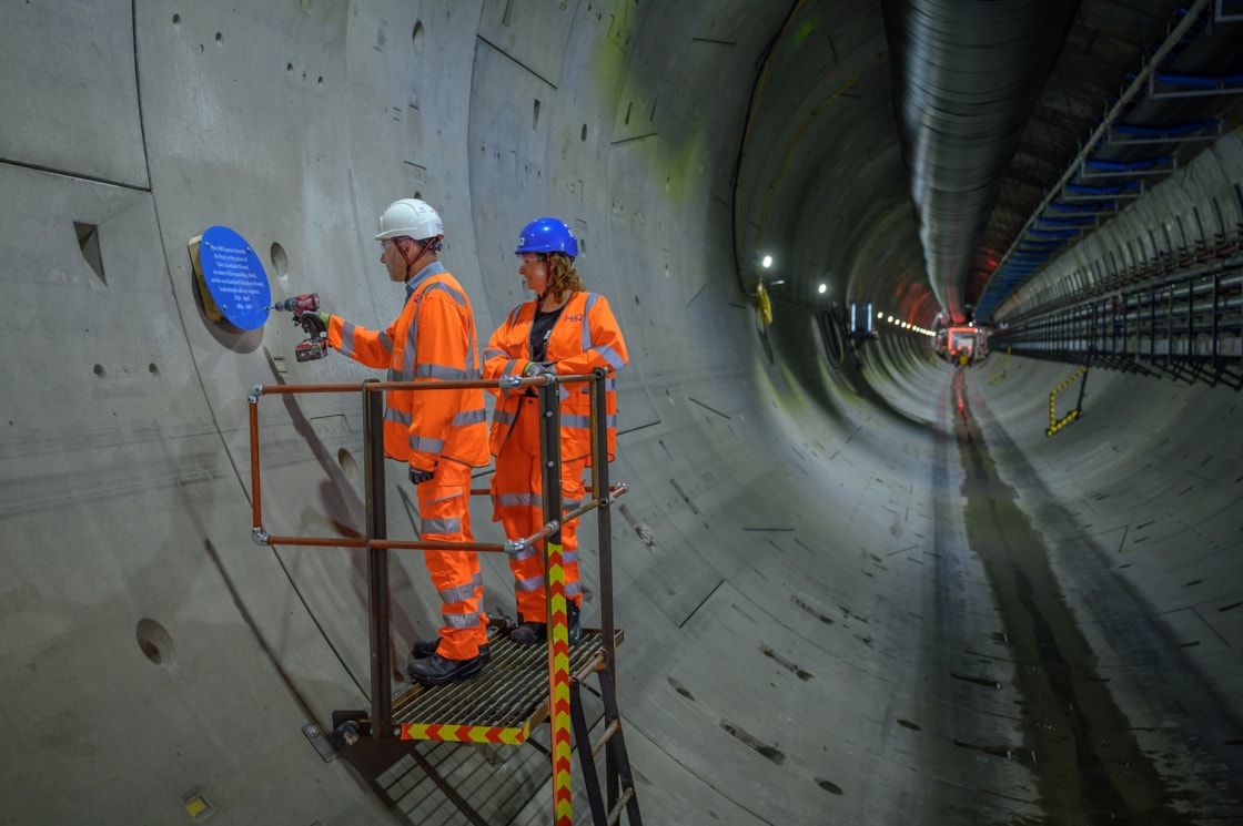 HS2 CEO Mark Wild installs a new plaque in the Euston Tunnel marking where it passes the final resting place of Sir Marc Brunel and his son Isambard Brunel