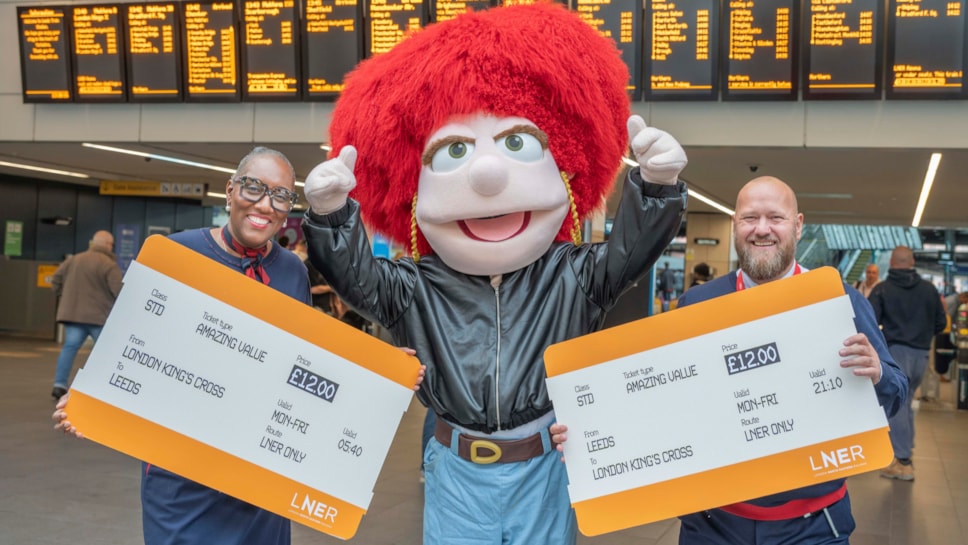 LNER colleagues in Leeds station with Eleanor to share £12 fare news