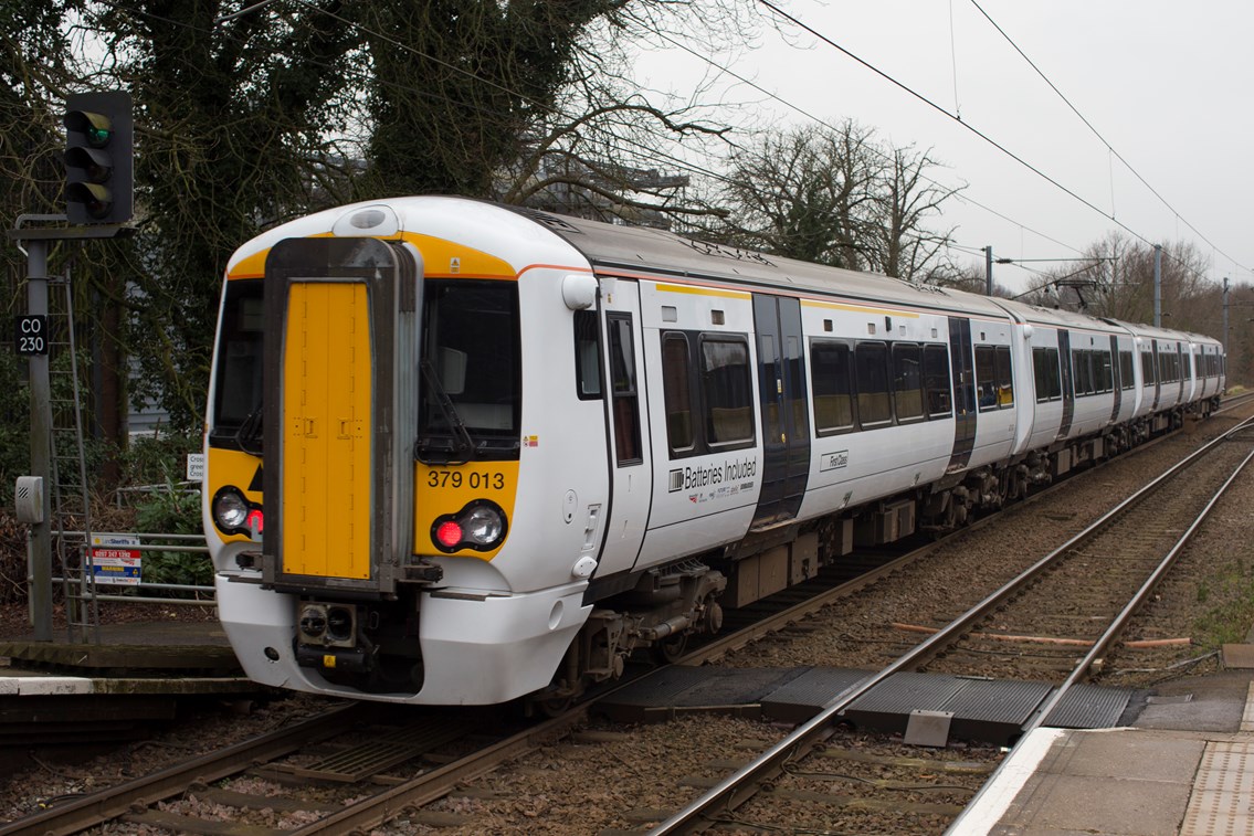 Battery-powered train (IPEMU) on level crossing: The new train contributes to Network Rail’s commitment to reduce its environmental impact, improve sustainability and reduce the cost of running the railway by 20 per cent over the next five years. It could ultimately lead to a fleet of battery-powered trains running on Britain’s rail network which are quieter and more efficient than diesel-powered trains, making them better for passengers and the environment. Network Rail and its industry partners – including Bombardier, Abellio Greater Anglia, FutureRailway and the Rail Executive arm of the Department for Transport (which is co-funding the project) – recognise the potential for battery-powered trains to bridge gaps between electrified parts of the network and to run on branch lines where it would be too expensive to install overhead electrification.