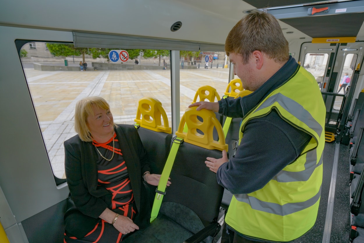 Minibuses 3: Leeds City Council passenger transport driver Adam Butterfield shows Councillor Debra Coupar (Leeds City Council’s deputy leader and executive member for resources) some of the features on one of the new Treka Mobility+ minibuses.