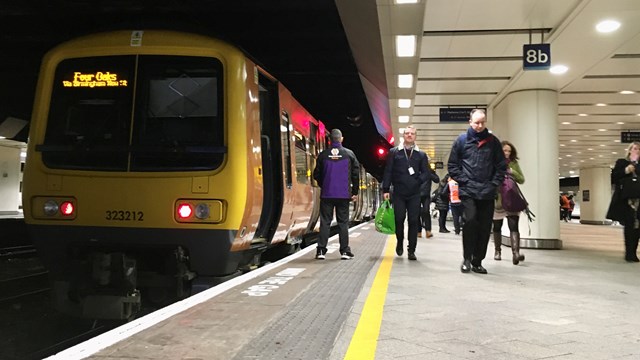 West Midlands Railway train on platform at Birmingham New Street