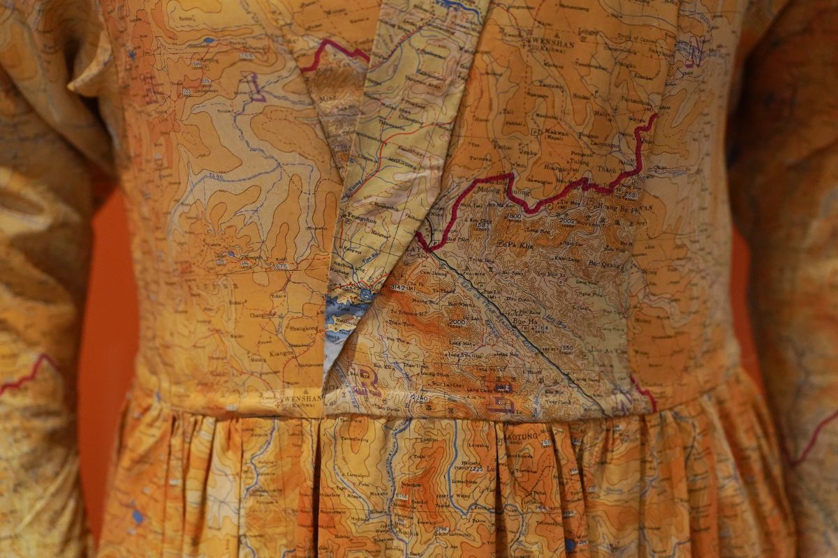 Detail of a  silk dress made from escape and evade maps used during the Second World War, on loan from Worthing Museum and Art Gallery. Image © Stewart Attwood