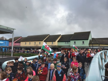 Schools marched across the new bridge with banners and flags
