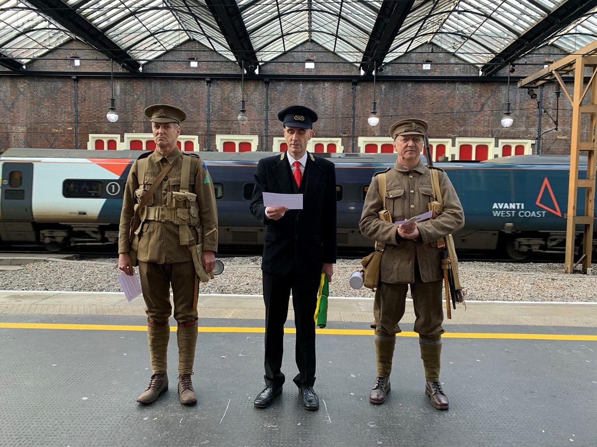 Volunteers dressed in period costumes as soldiers and a Station Master read out the names of the railway workers who are honoured on the Stoke Station War Memorial Arch