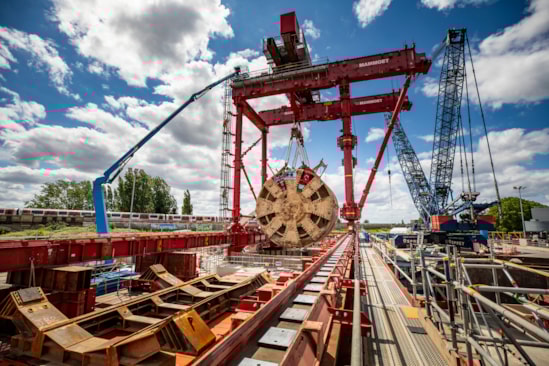 TBM Caroline lifted out of vent shaft at Green Park Way, Greenford - 25 May 2025: HS2 lifts Tunnel Boring Machine (TBM) ‘Caroline’ from below ground at the Green Park Way site in Greenford, West London.

On Sunday 25th May, engineers working on the HS2 project lifted the TBM 9.48metre diameter cutterhead, front and middle shield, weighing 850 tonnes, using a large gantry crane. The tunnelling machine concluded its 5mile journey from West Ruislip in April, arriving in an underground reception chamber. TBM Caroline excavated over 1.2 million tonnes of earth and installed 4,217 tunnel rings.
