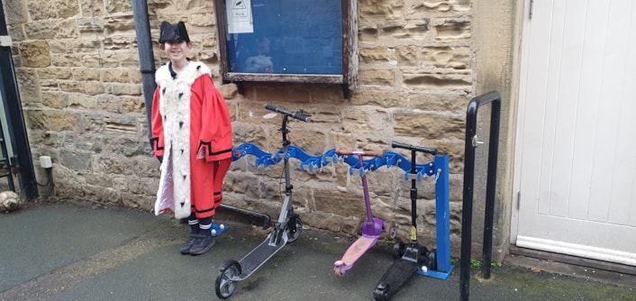 Children's Mayor, Sienna from Harewood Church of England Primary School with scooter rack: Children's Mayor, Sienna from Harewood Church of England Primary School with scooter rack