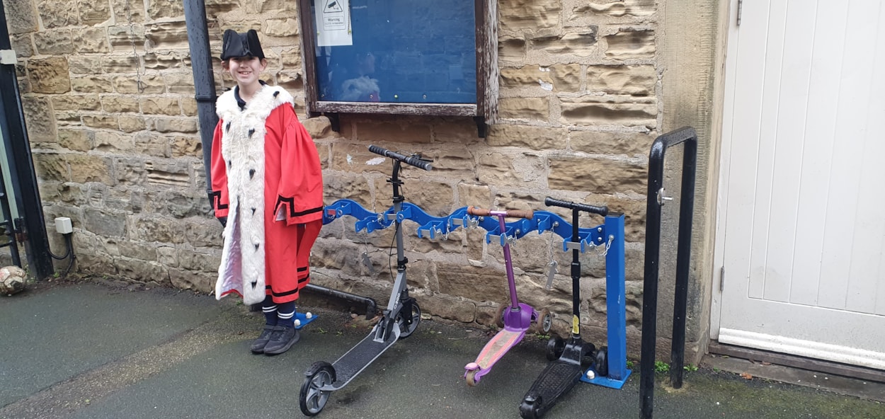 Children's Mayor, Sienna from Harewood Church of England Primary School with scooter rack: Children's Mayor, Sienna from Harewood Church of England Primary School with scooter rack