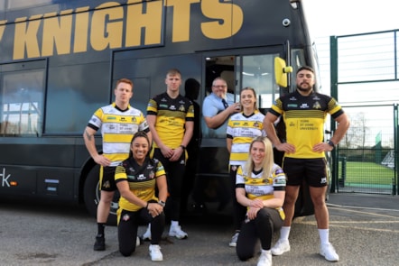 First York driver and Knights fan Pete Richardson with players and the electric bus branded in the club colours 2