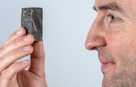 National Museums Scotland Research Associate Sandy Hetherington with sample of the 410 million year-old fossil of Prototaxites