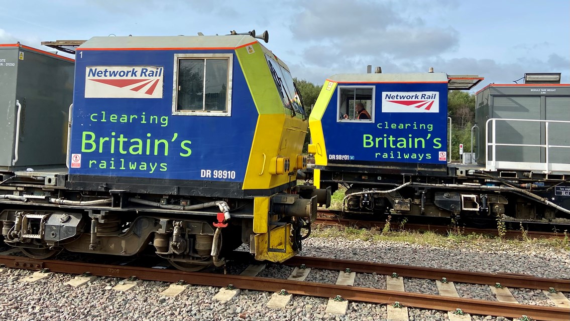 Autumn leaf blasting trains now keeping North West rail routes clear: Two autumn treatment trains or MPVs facing each other
