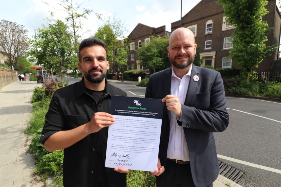 Cllr Mete Coban and Mayor Philip Glanville with the UK100 pledge