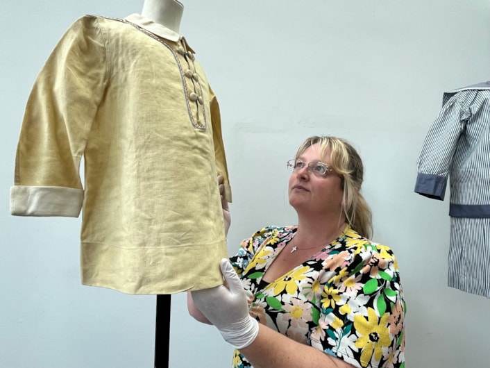 Sailor suits: Gemma Brown, site development officer at the Leeds Discovery Centre, with one of the eye-catching sailor suit style outfits in the Leeds collection.
The eye-catching naval attire includes a classic range of blue and white outfits, dresses and bellbottom trousers, looks which became hugely popular for children during the late 19th and early 20th centuries.
The suits are among an array of historic fashions which will be explored in an upcoming workshop at Leeds Discovery Centre looking back on centuries of fabulous clothes and costumes.