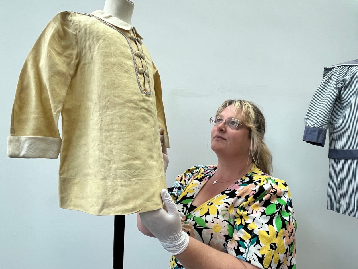 Sailor suits: Gemma Brown, site development officer at the Leeds Discovery Centre, with one of the eye-catching sailor suit style outfits in the Leeds collection.
The eye-catching naval attire includes a classic range of blue and white outfits, dresses and bellbottom trousers, looks which became hugely popular for children during the late 19th and early 20th centuries.
The suits are among an array of historic fashions which will be explored in an upcoming workshop at Leeds Discovery Centre looking back on centuries of fabulous clothes and costumes.